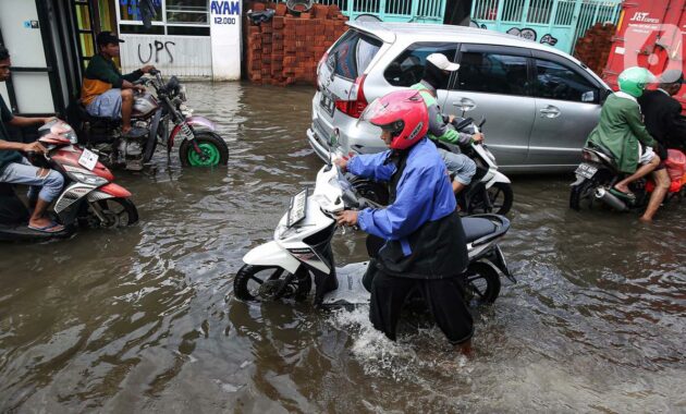 000948300_1738211828-20250130-Banjir_Jalan_Kamal-ANG_4