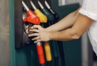 045704700_1661740212-elegant-woman-standing-gas-station